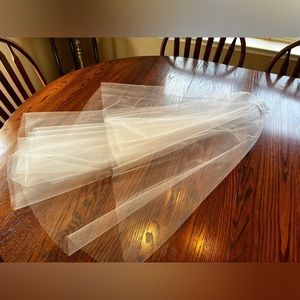 Finger tip length wedding veil with blusher